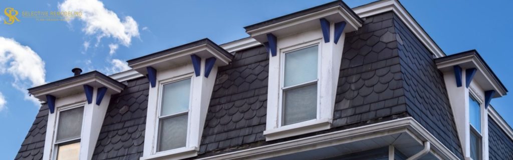 Close-up view of a shed dormer with sloped roof, adding space and natural light to the upper level of a home.