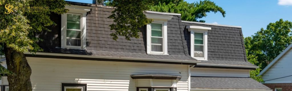 Elegant home featuring a dormer with a covered porch, showcasing stylish architecture and functional design.