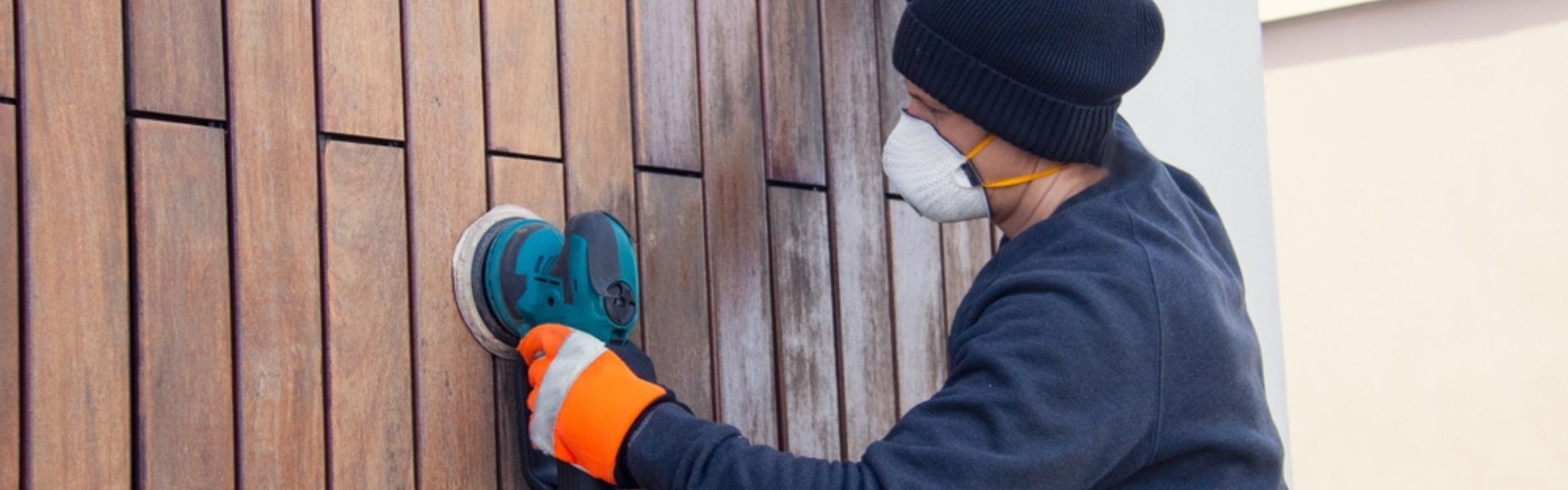 Close-up of a home exterior with natural wood siding, showcasing its timeless appeal and detailed craftsmanship.